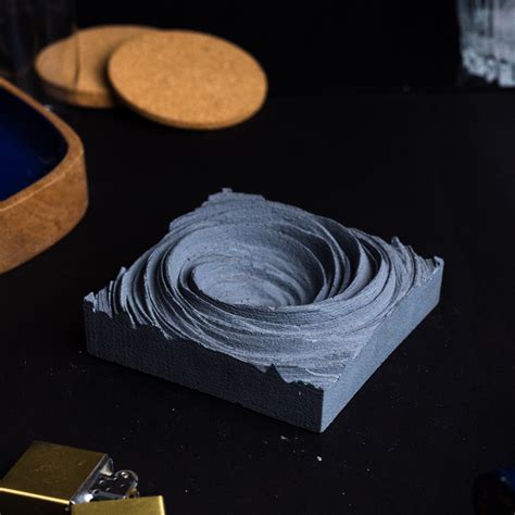Cyclone Dark Concrete - Spiral Design ashtray resting on a square base ...
