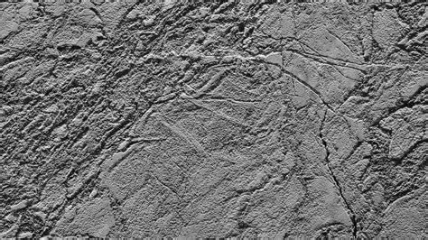 Premium Photo | A grey stone wall with a rough texture The wall is ...