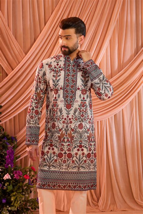 White chikankari kurta with detailed floral embroidery and sequin