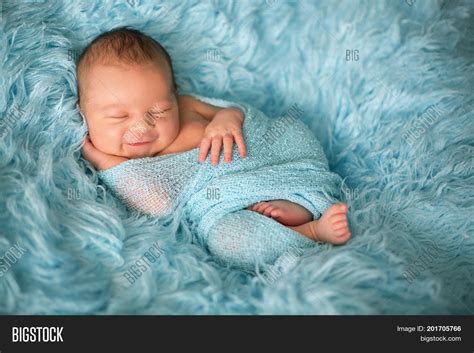Newborn Baby Smiling In Sleep