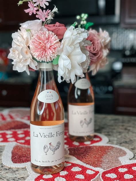 Wine Bottle Floral Centerpieces - Helen G. Bailey