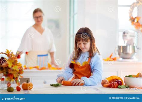 Family Cooking Thanksgiving Dinner Stock Photo - Image of grandmother ...