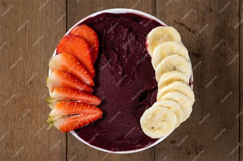 Premium Photo | White bowl of brazilian frozen acai berry with banana ...