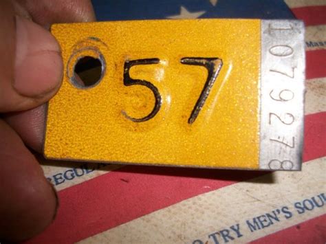 1957 MINNESOTA VEHICLE LICENSE PLATE RENEWAL TAX TAB CAR MN TOPPER ...