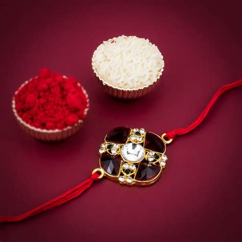Sukkhi Classic Gold Plated Round Red Rakhi with Roli Chawal and Raksha ...