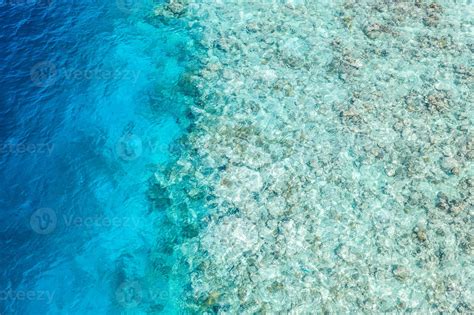 Beautiful coral reef in Maldives island, aerial landscape, shallow sea water as lagoon. Amazing ...