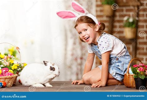 Happy Easter! Happy Funny Child Girl Playing with Bunny Stock Photo ...