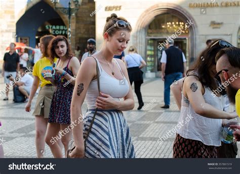 Woman walking through Old Town streets in Prague, Czech Republic stock ...