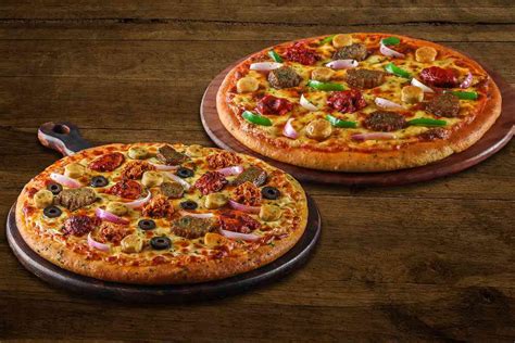 Order Two Loaded Non Veg Medium Pizza Combo online from Ovenstory