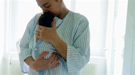 Mother Cradling Newborn Baby In Striped Stock Footage SBV-349028802 ...