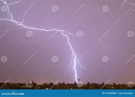 Lightning Streak from a Thunderstorm Cloud at Night in a Rural Setting ...