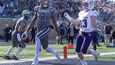 Monmouth football rolls past Holy Cross to first playoff win
