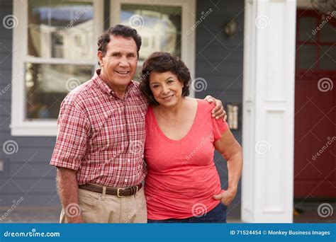 Portrait of Senior Hispanic Couple Standing Outside House Stock Photo ...