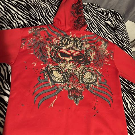 MMA Elite hoodie Red and black skull and crossbones... | Depop
