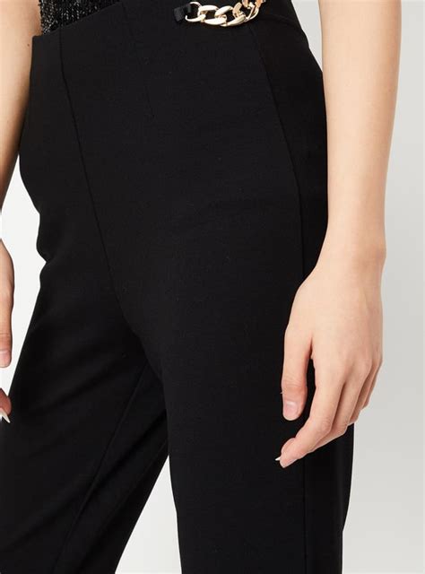 Buy Women Chain-Detailed Flared Trousers Online at just Rs. 1199.0 ...