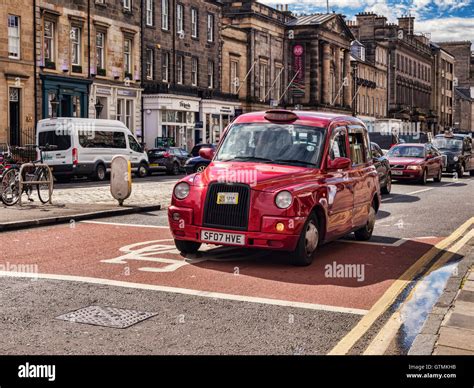Red taxi hi-res stock photography and images - Alamy