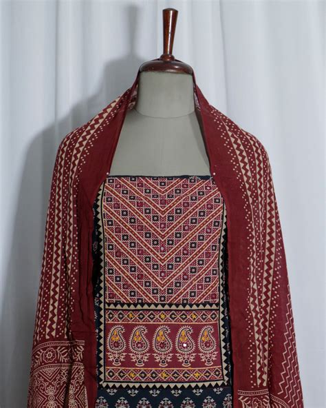 Mirror worked Ajrakh Handprinted cotton Suit set with mul-mul dupatta ...