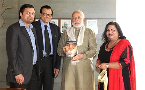Narendra Modi presented with English translation of late Shri MKK Nair ...