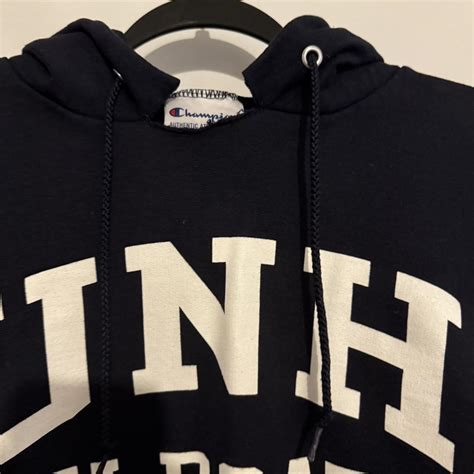 Navy Champion UNH Wildcats hoodie with intentionally... | Depop