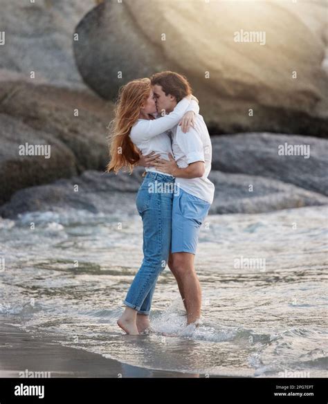 Love, kiss and happy with couple at beach for romance, relax and ...