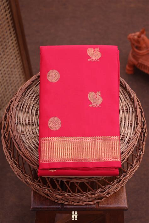 Kanchipuram Silk Saree In Crimson Red With Peacock Buttas