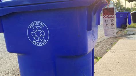 Outagamie County tagging recycling bins containing non-recyclable materials
