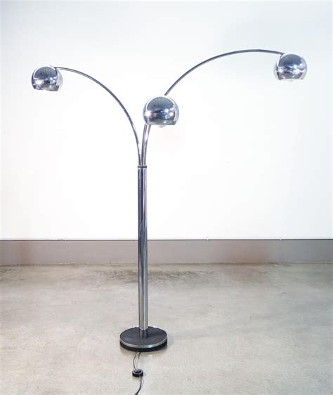 Three-lumen floor lamp, design REGGIANI, made of chrome-plated metal ...