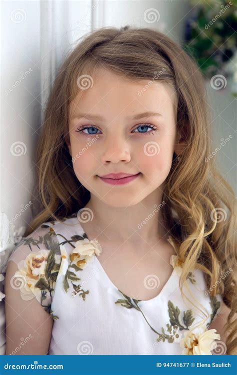 Portrait of a Girl Seven Years Old with Blond Hair and White Dress ...