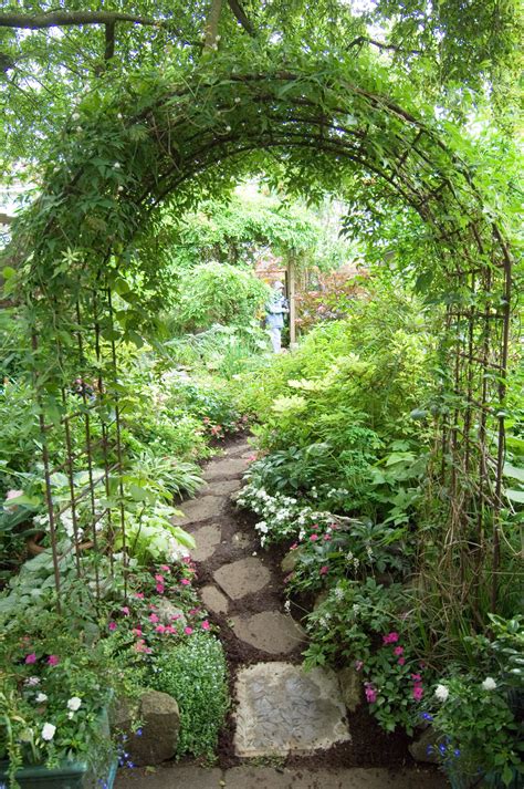 Arch and path | Beautiful gardens, Garden arches, Garden archway