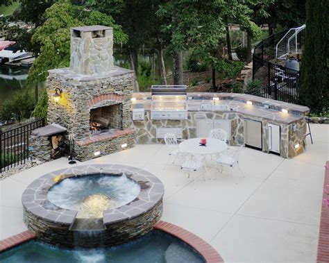 Outdoor Kitchen Fireplace with Built-in Gill and Waterfall