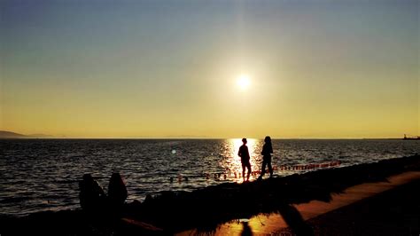 Silhouette of Love Couple Standing on Beach Talking at Sunset Footage. 26789798 Stock Video at ... - silhouette of love