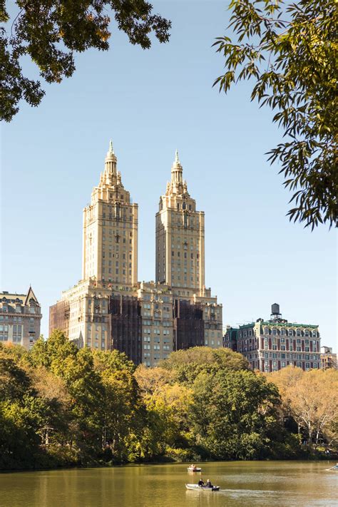 Download Buildings Overlooking Central Park Lake Wallpaper | Wallpapers.com