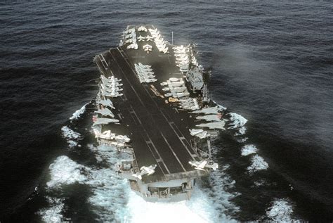 an aircraft carrier in the middle of the ocean