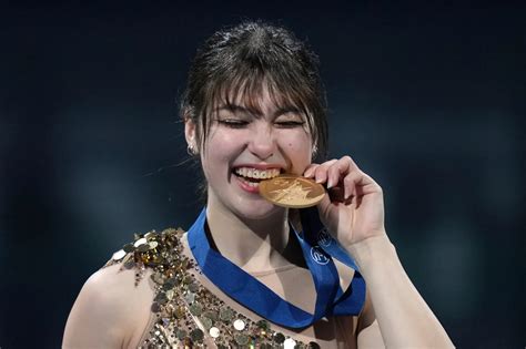Feb 19, 2026; Milan, Italy; Alysa Liu of the United States celebrates with the gold medal in the women's free skate during the Milano Cortina 2026 Olympic Winter Games at Milano Ice Skating Arena. Mandatory Credit: James Lang-Imagn Images