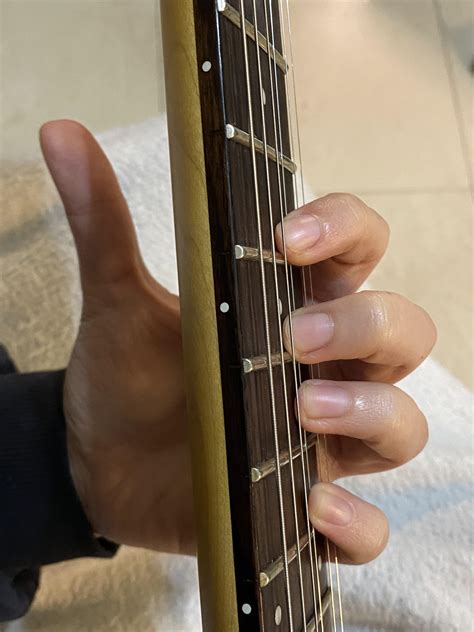 How should I position my thumb during the spider exercise? I find it easier to keep it away and ...