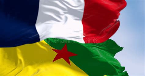 Flags of French Guiana and France Waving in the Wind on a Clear Day ...