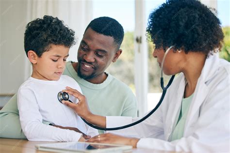 Premium Photo | African dad child and woman doctor with stethoscope in doctors office for health ...