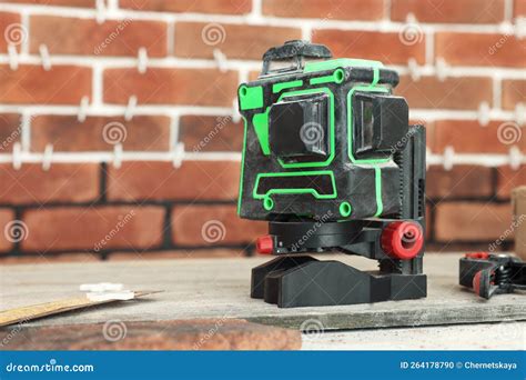 Modern Cross Line Laser Level on Floor Indoors, Space for Tex. Tiles ...