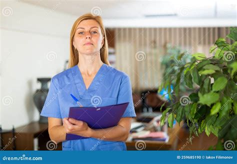Female Doctor Assistant Standing in Medical Office Stock Photo - Image of clinician, workspace ...