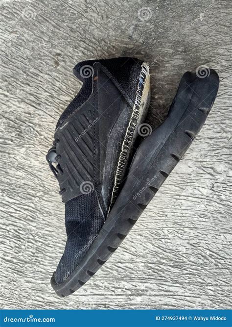 Old Broken Black Shoe on Concrete Floor Background Stock Photo - Image ...