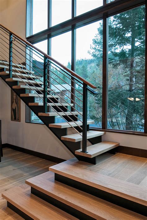 Truckee, CA | This stairwell is open to stunning forest views and warm ...