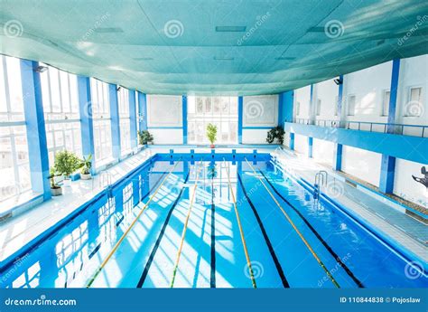 An Interior of an Indoor Public Swimming Pool. Stock Photo - Image of ...