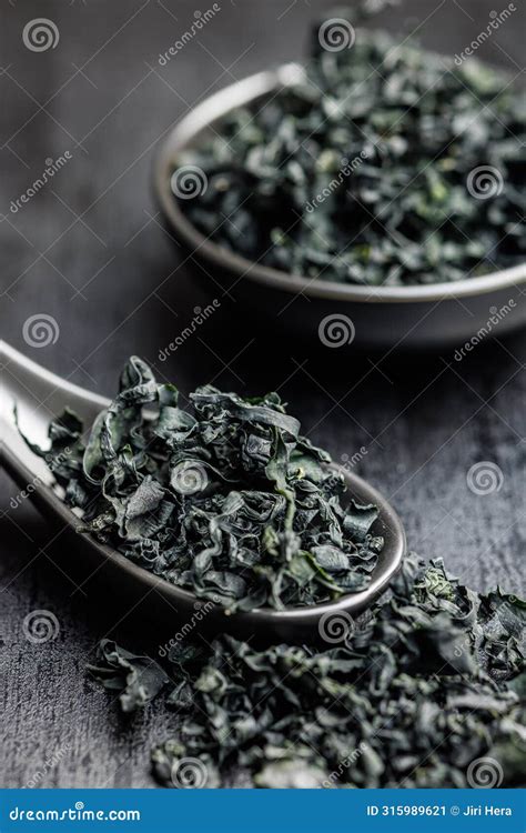 Dried Wakame Seaweed in Spoon on Black Table Stock Image - Image of ...