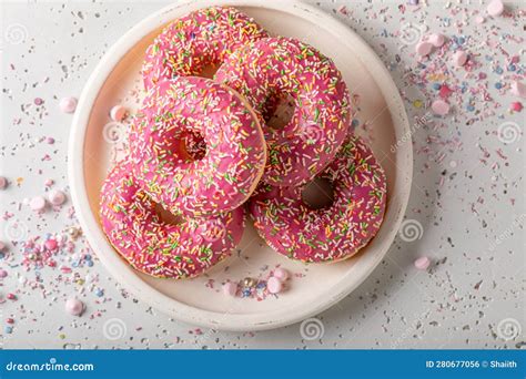 Fresh and Yummy Pink Donuts Topped with Sprinkles Stock Photo - Image ...