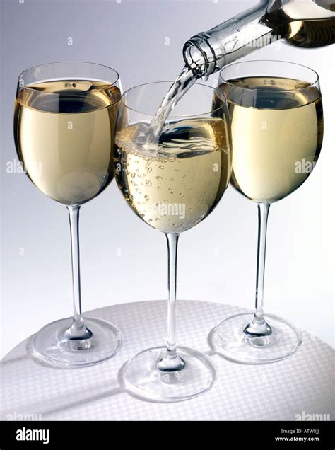 THREE GLASSES OF WHITE WINE Stock Photo - Alamy
