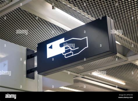 A man walks past an automated teller machine (ATM) outside Bank of America Corp. headquarters in Cha Vector Art