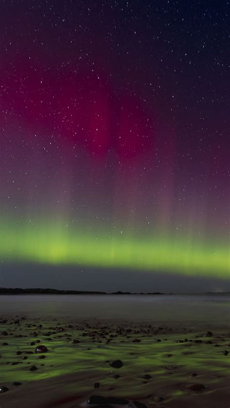 Download wallpaper 2160x3840 northern lights, coast, sand, pebbles, sea ...