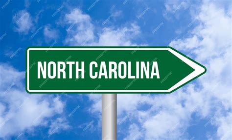 Premium Photo | North carolina road sign on sky background