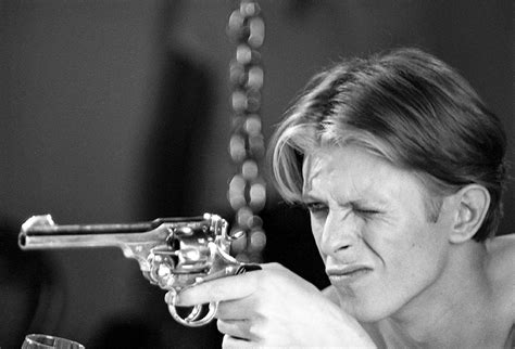 David Bowie: on Set with pistol 1975 - MAC054 - Geoff Maccormack Collection
