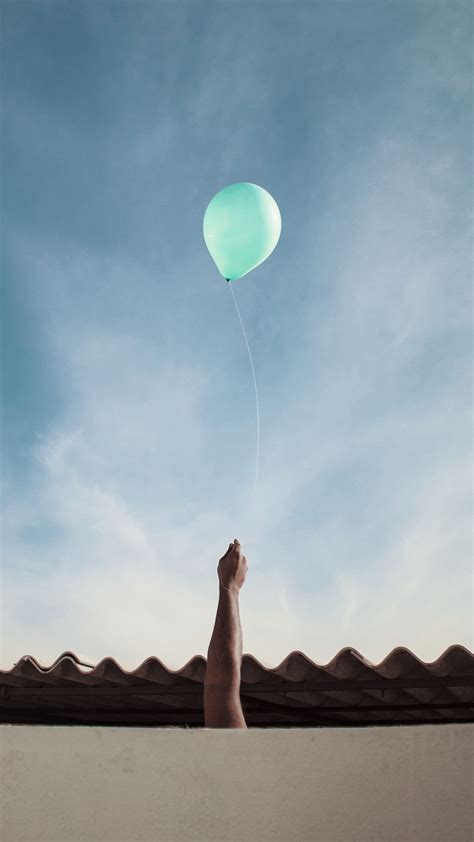 Download wallpaper 1350x2400 air balloon, hand, roof, sky, clouds ...